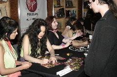 Julie signs