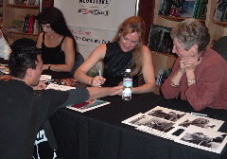 Debra signs